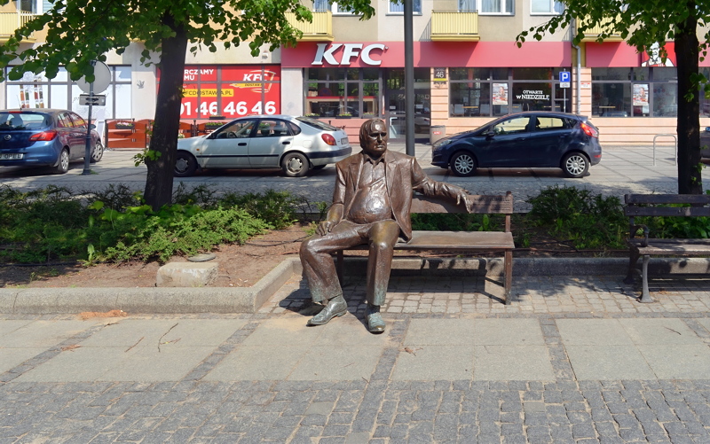 19 - The bronze monument of Polish actor Marek Perepeczko sitting on a bench along the Avenue of the Blessed Virgin Mary in Częstochowa, Poland, sculpted by Wojciech Pondel